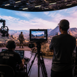 Film crew working on a virtual production LED volume stage during a shoot